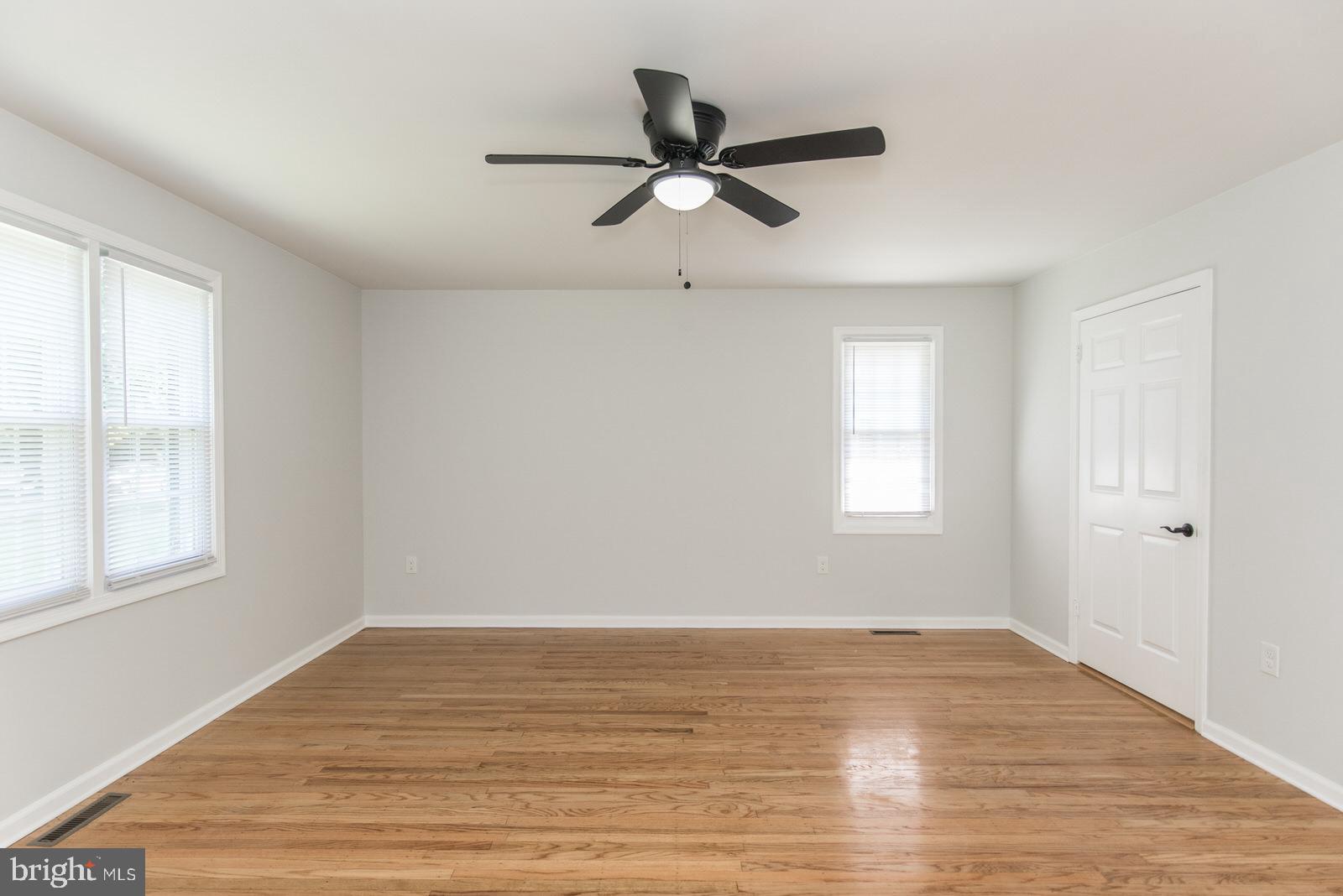 558 Sentinel Road Moorestown, NJ 08057 - Photo 61 of 144 a view of empty room with wooden floor and fan