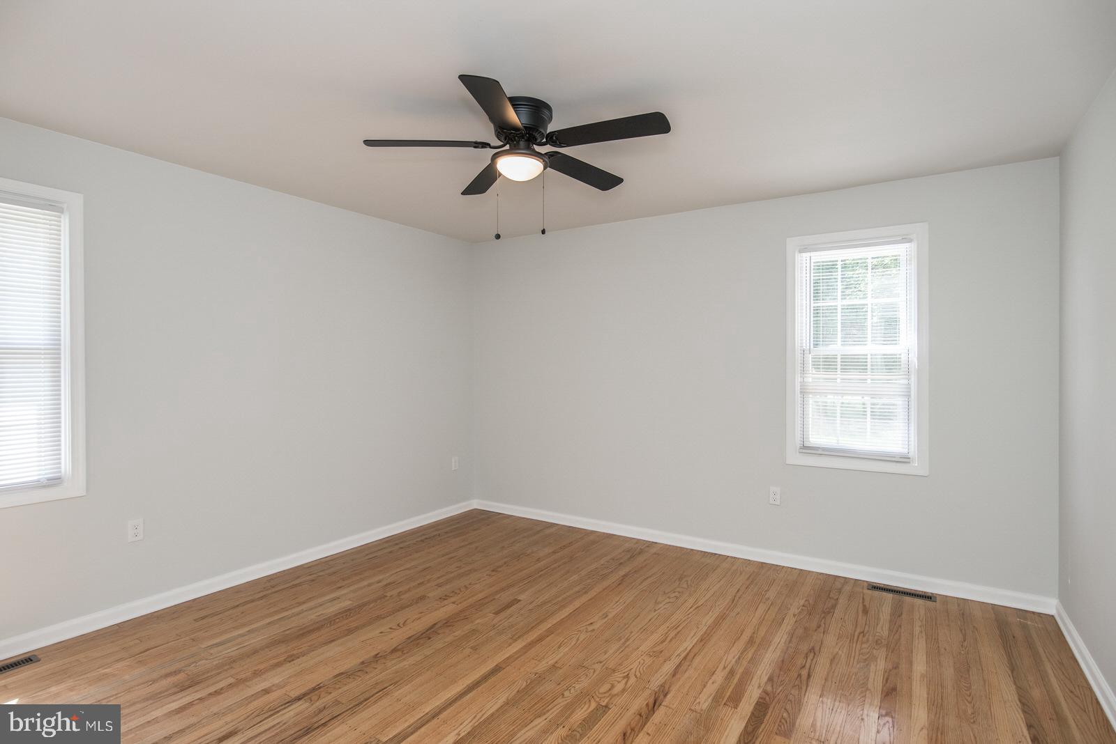 558 Sentinel Road Moorestown, NJ 08057 - Photo 81 of 144 a view of empty room with wooden floor and fan