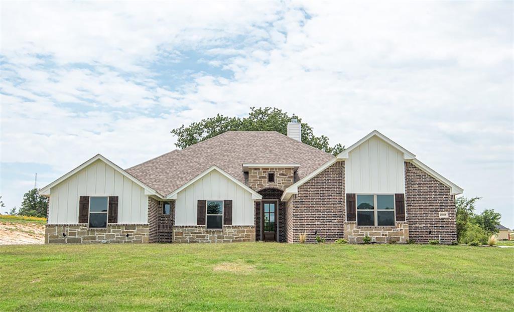 10008 Valley Oak Ct Lane Springtown, TX 76082 - Photo 1 of 1 a front view of house with yard and green space