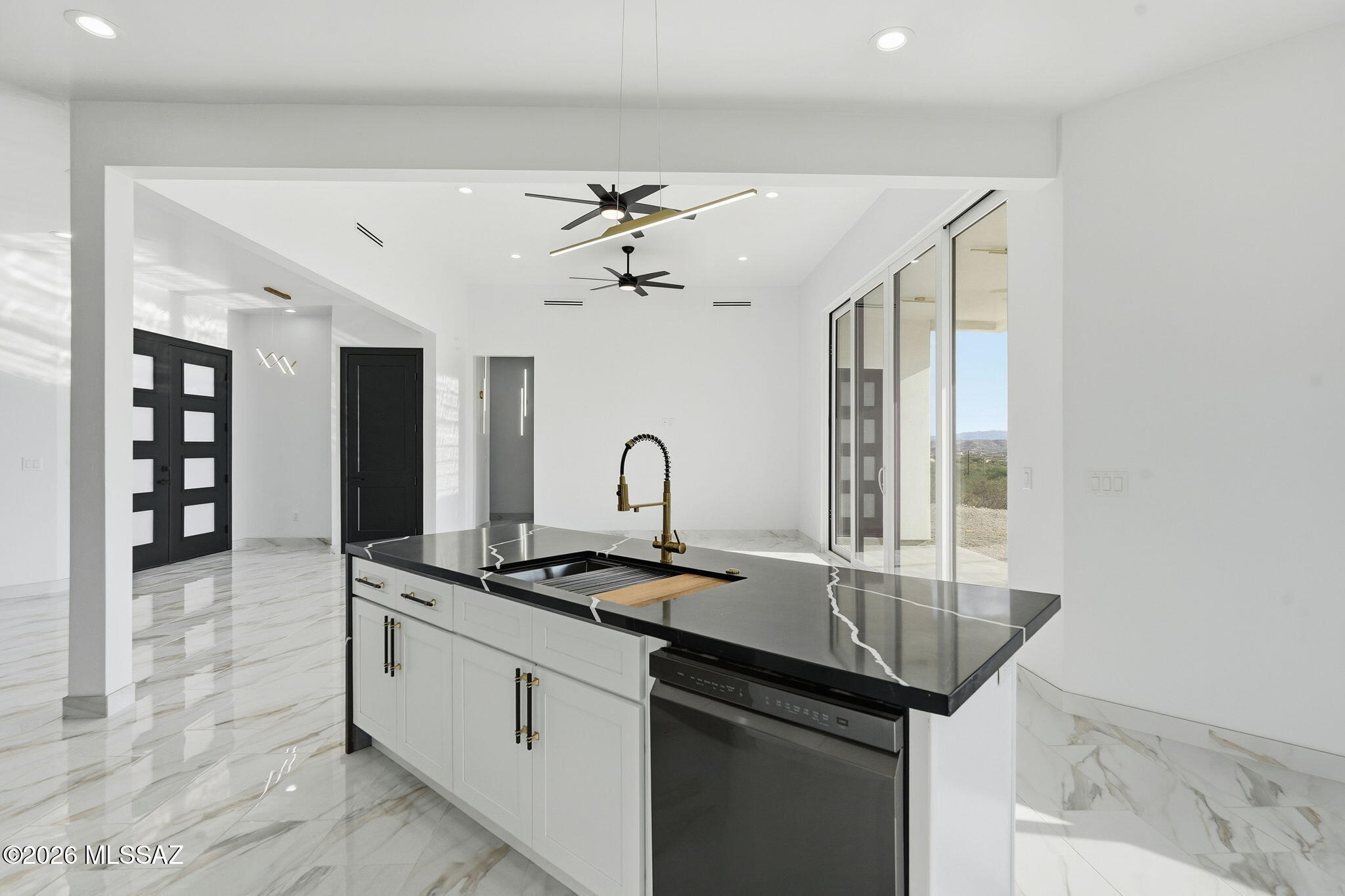 1786 Peralta Court Rio Rico, AZ 85648 - Photo 21 of 50 a kitchen that has a sink and a stove in it
