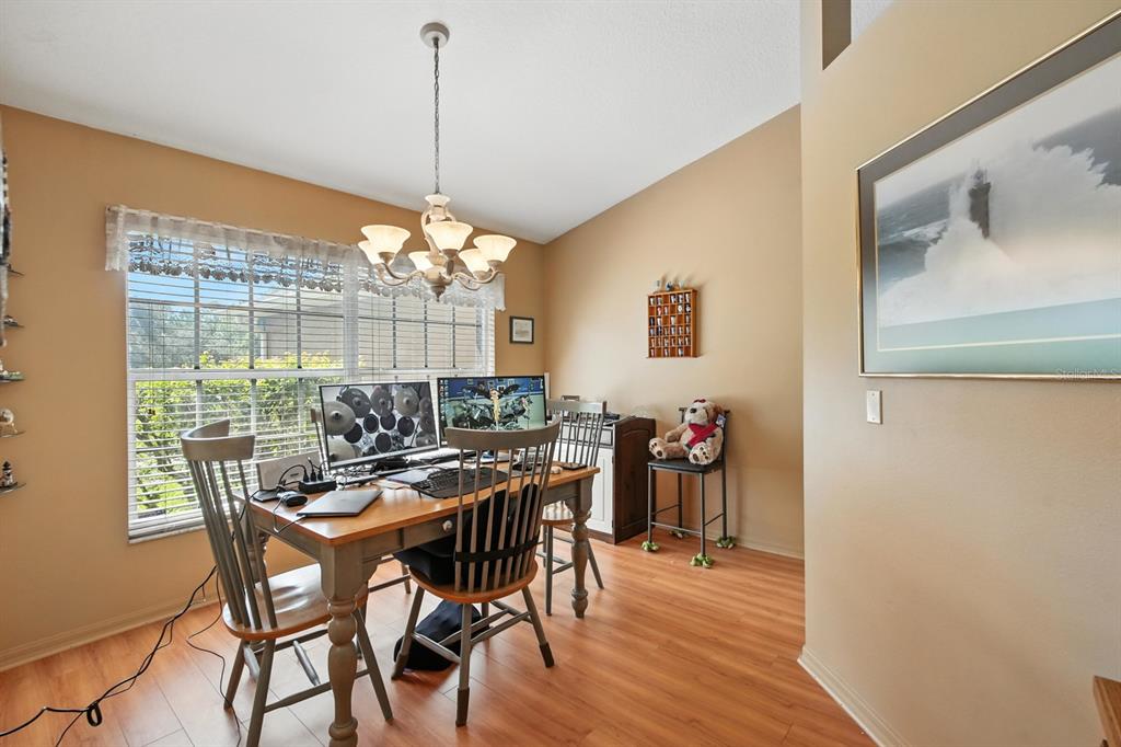 29933 Fullerville Road DeLand, FL 32720 - Photo 11 of 57 a view of a dining room with furniture window and wooden floor
