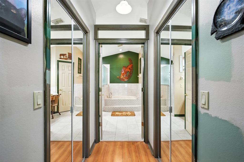 29933 Fullerville Road DeLand, FL 32720 - Photo 16 of 57 a view of a hallway with wooden floor and staircase