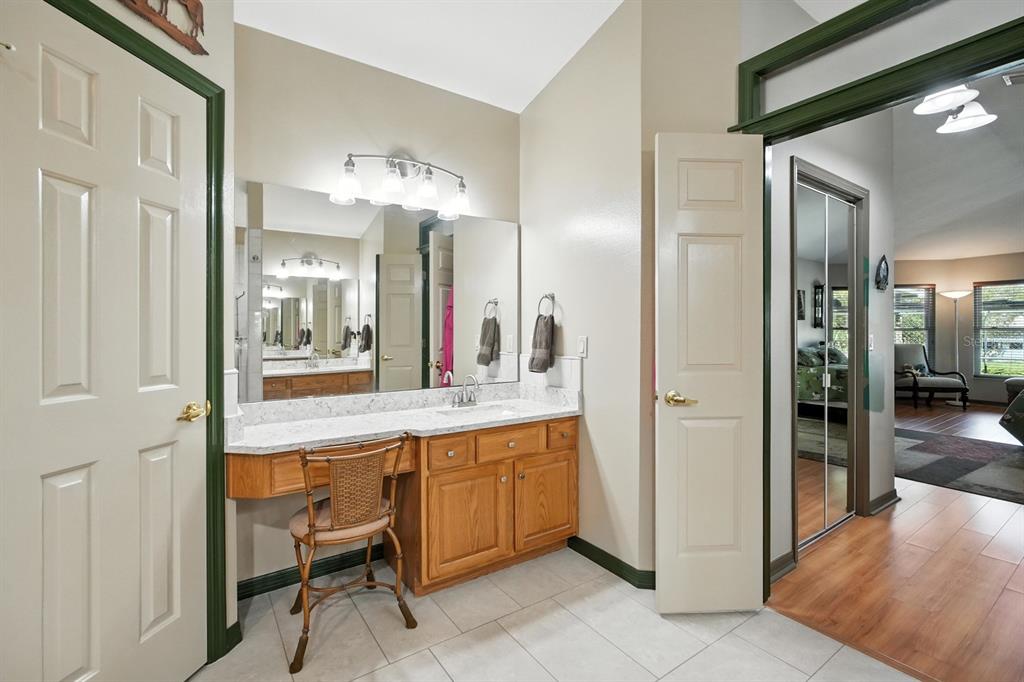 29933 Fullerville Road DeLand, FL 32720 - Photo 18 of 57 a large bathroom with a glass door shower and sink