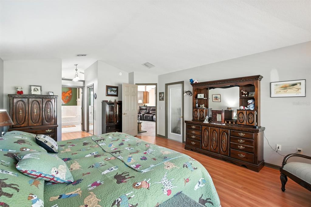 29933 Fullerville Road DeLand, FL 32720 - Photo 20 of 57 a bed room with bed and wooden floor