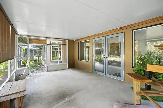 a view of a house with a yard and tree