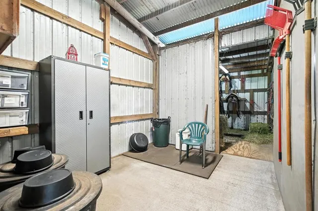 a bed room with a bed and a television