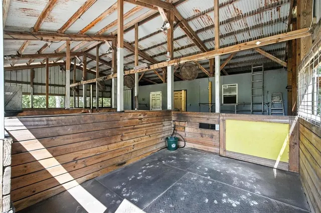 a view of backyard with wooden fence