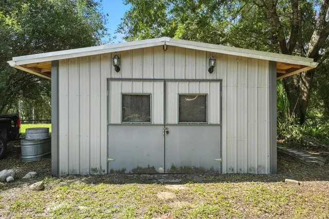 a view of a green field with lots of trees