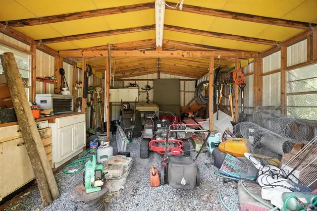 a view of a house with a yard and sitting area