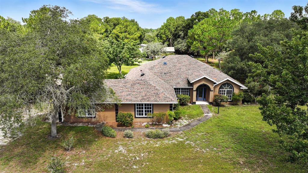 29933 Fullerville Road DeLand, FL 32720 - Photo 45 of 57 a front view of a house with yard and green space