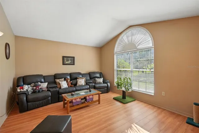 a living room with furniture and a window