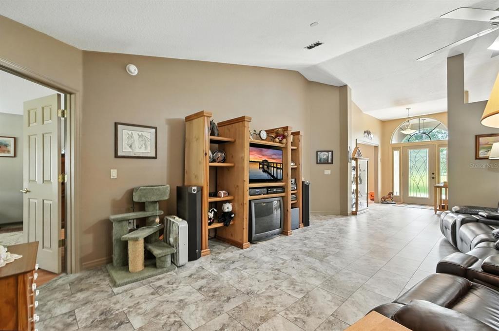 29933 Fullerville Road DeLand, FL 32720 - Photo 6 of 57 a view of a livingroom with furniture and workspace
