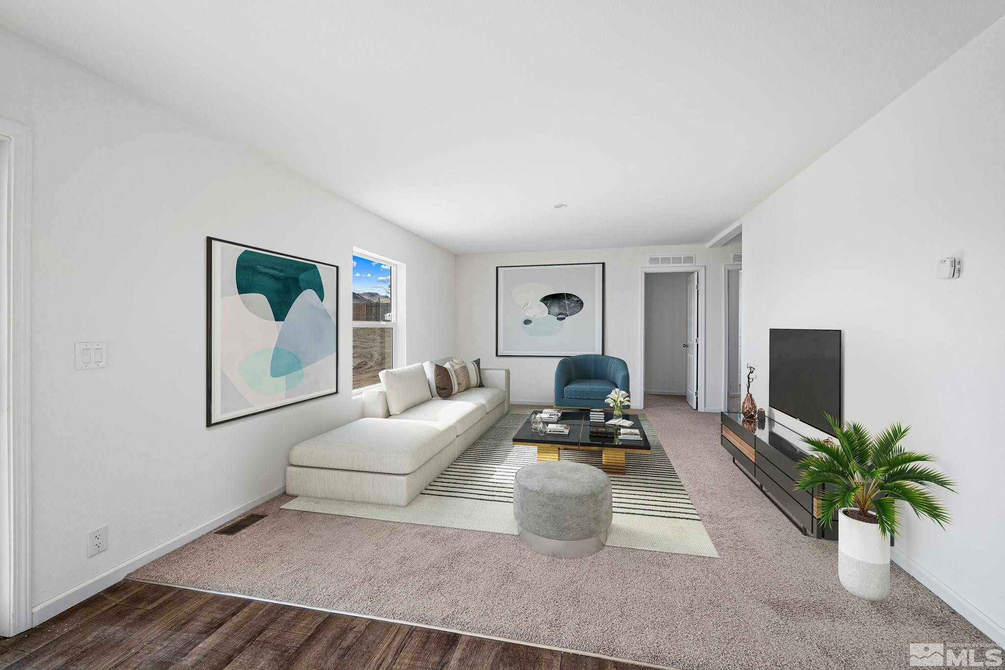 1435 East 8th Street Silver Springs, NV 89429 - Photo 14 of 30 a living room with furniture and a flat screen tv