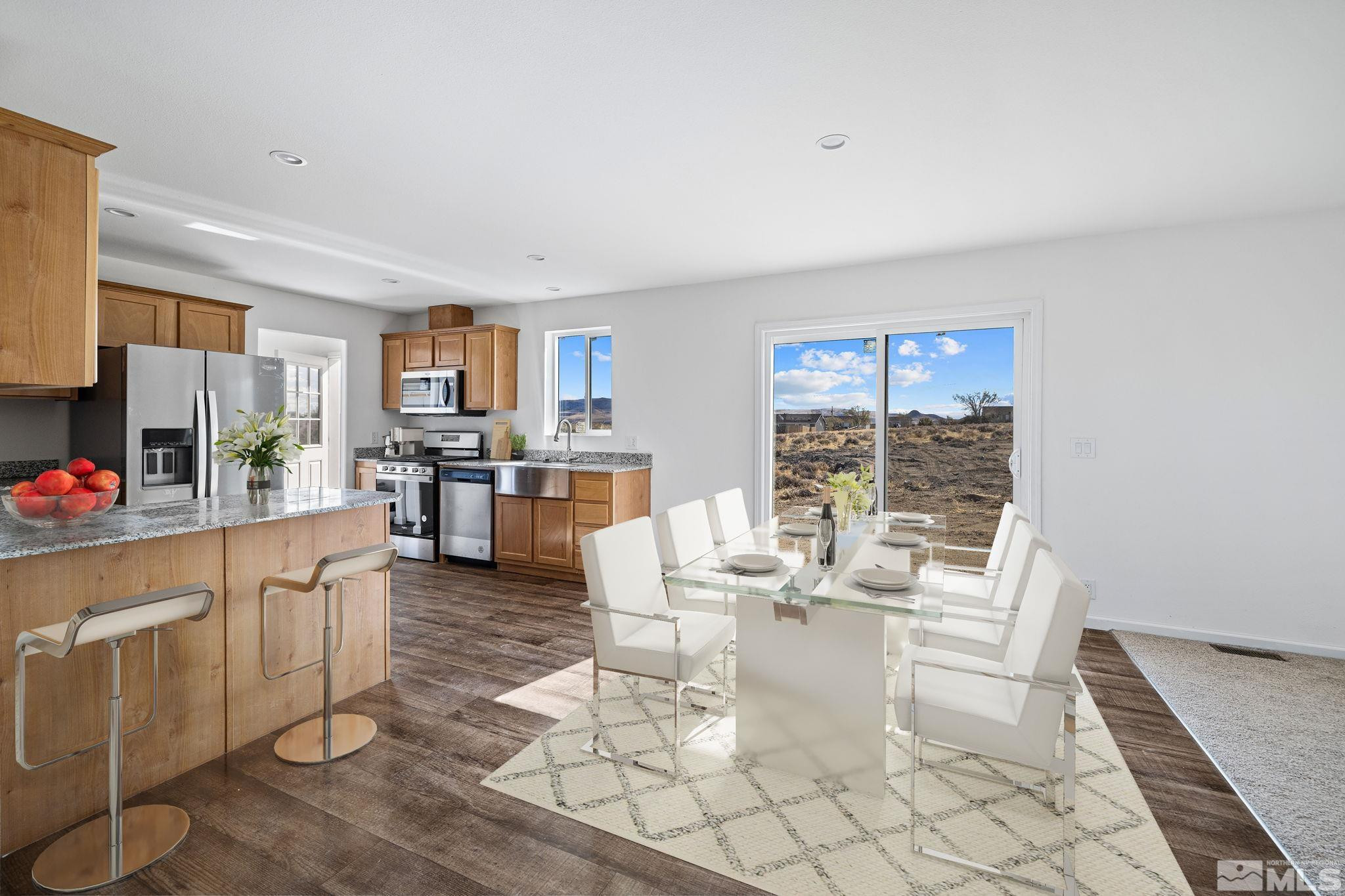 1435 East 8th Street Silver Springs, NV 89429 - Photo 17 of 30 a living room with fireplace furniture and a large window