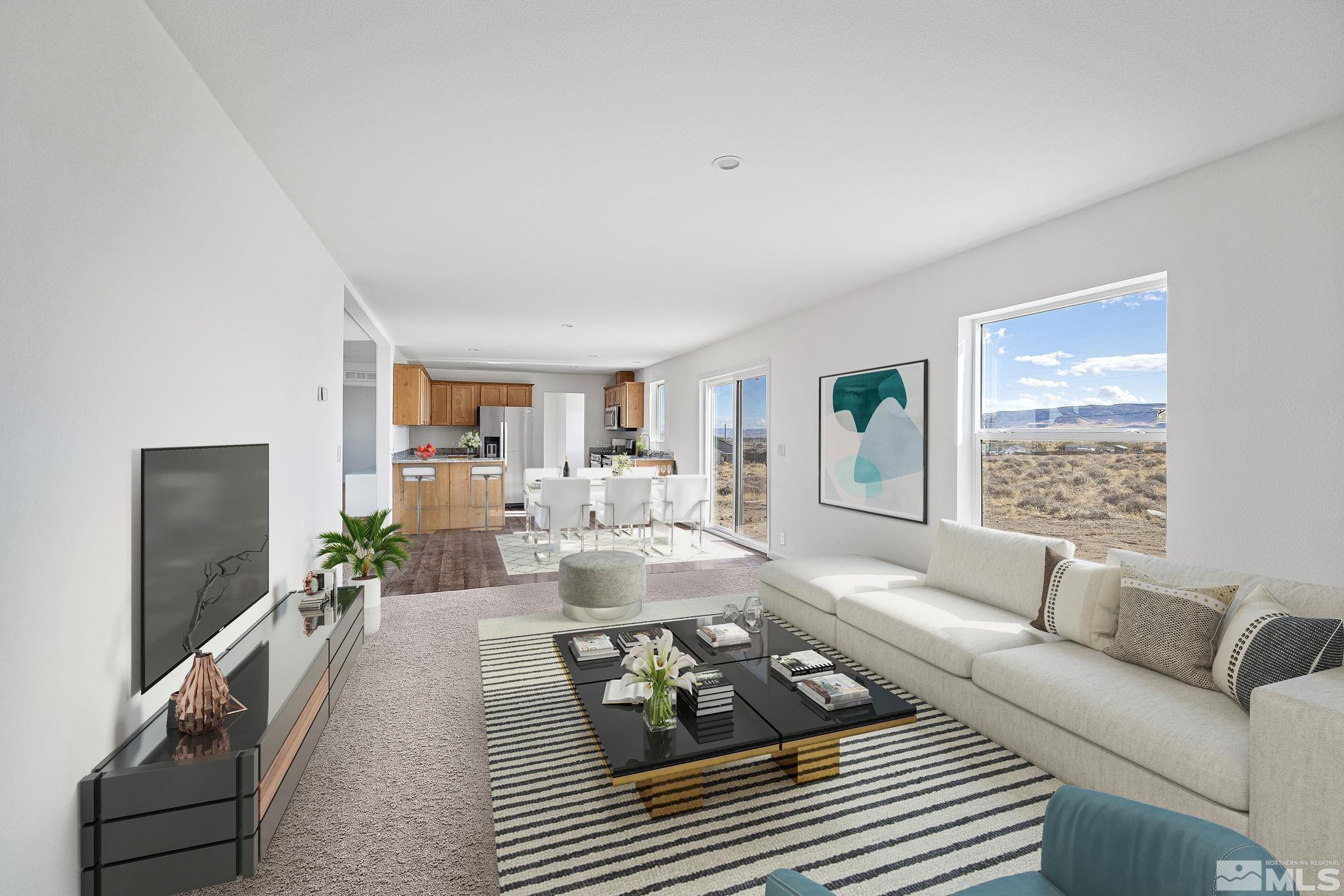 1435 East 8th Street Silver Springs, NV 89429 - Photo 19 of 30 a living room with furniture and a flat screen tv