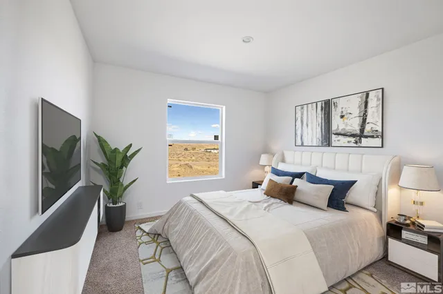 a bedroom with a bed and a potted plant