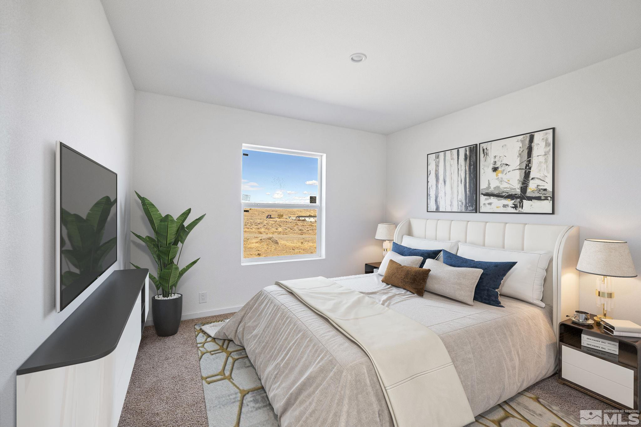 1435 East 8th Street Silver Springs, NV 89429 - Photo 25 of 30 a bedroom with a bed and a potted plant