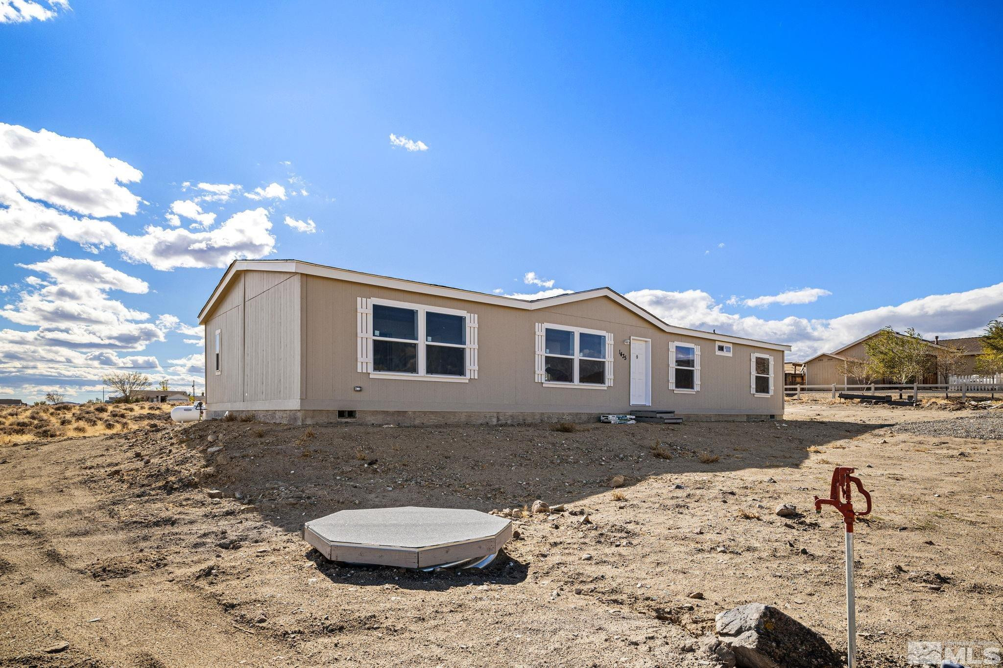 1435 East 8th Street Silver Springs, NV 89429 - Photo 10 of 30 a house view with a backyard space