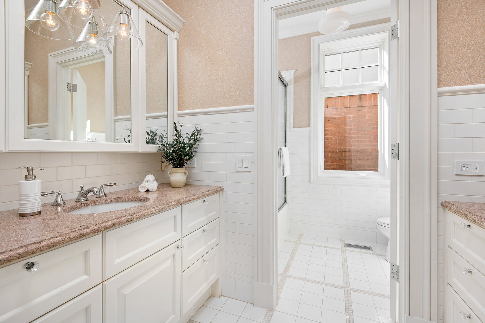 1921 North Mohawk Street Chicago, IL 60614 - Photo 21 of 44 a bathroom with a granite countertop sink a mirror and a