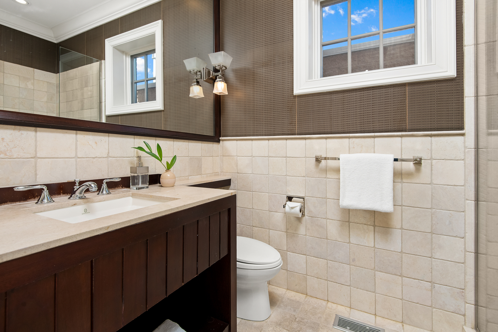 1921 North Mohawk Street Chicago, IL 60614 - Photo 27 of 44 a bathroom with a sink a toilet and mirror