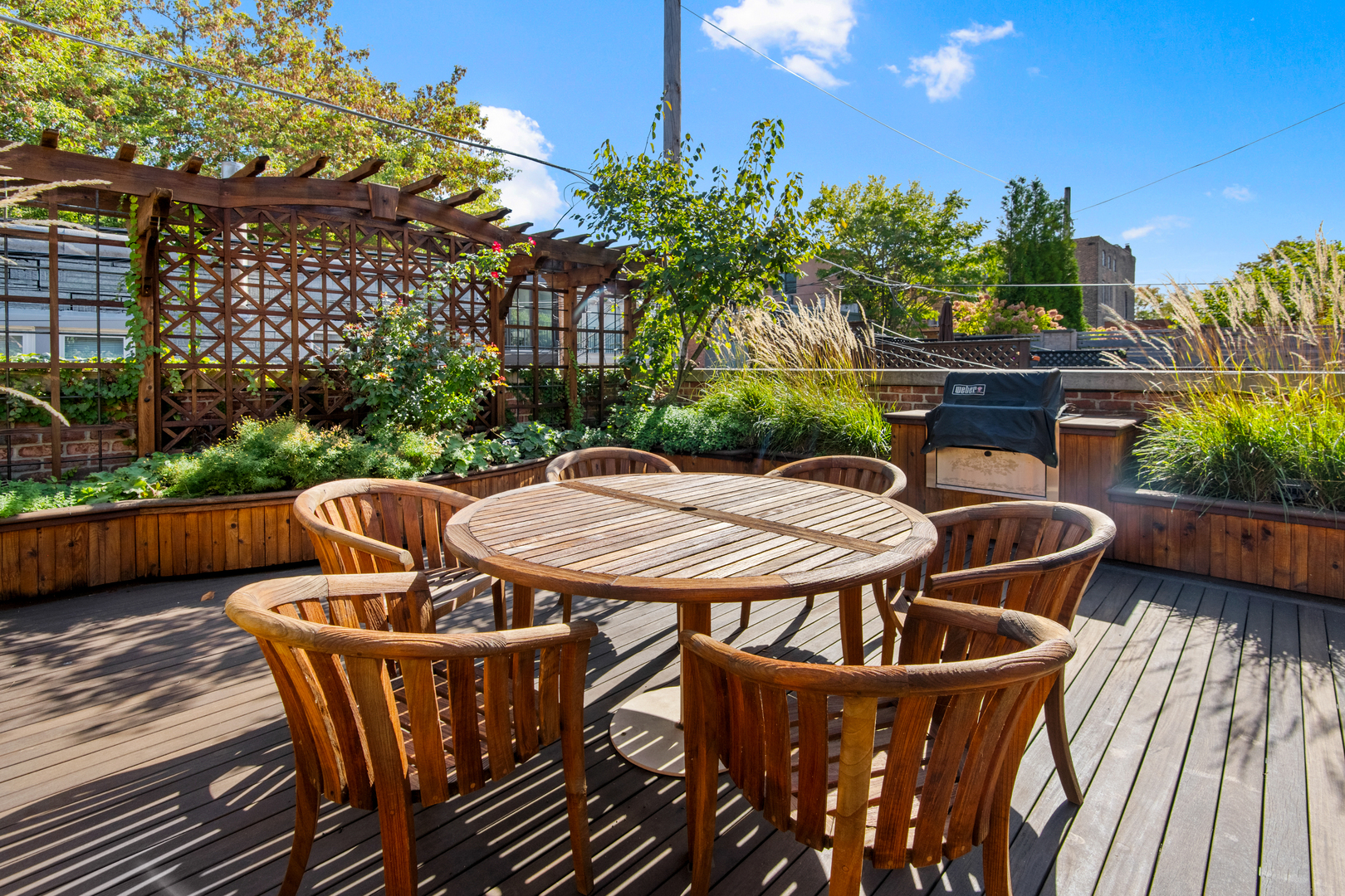 1921 North Mohawk Street Chicago, IL 60614 - Photo 39 of 44 a view of a patio with table and chairs with wooden floor and plants