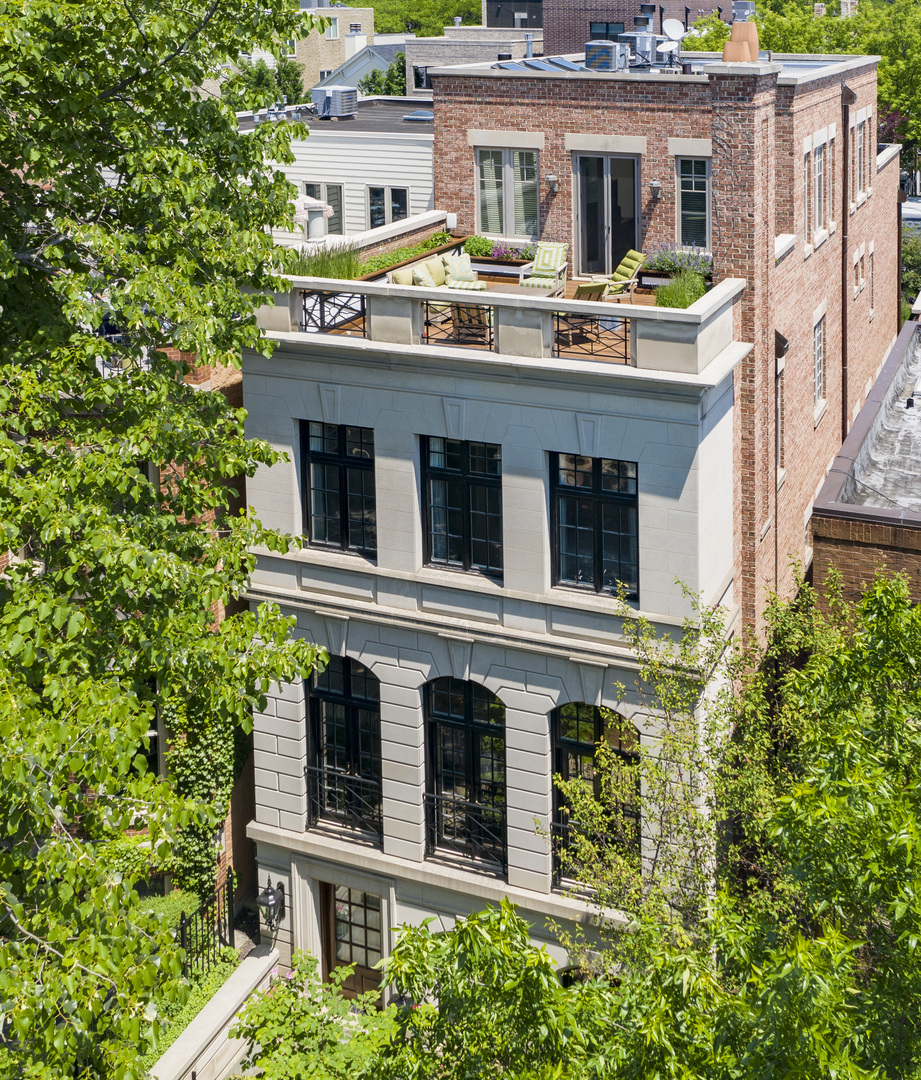 1921 North Mohawk Street Chicago, IL 60614 - Photo 40 of 44 a balcony with potted plants and large tree