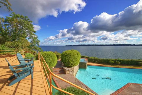 a view of a swimming pool with lounge chair