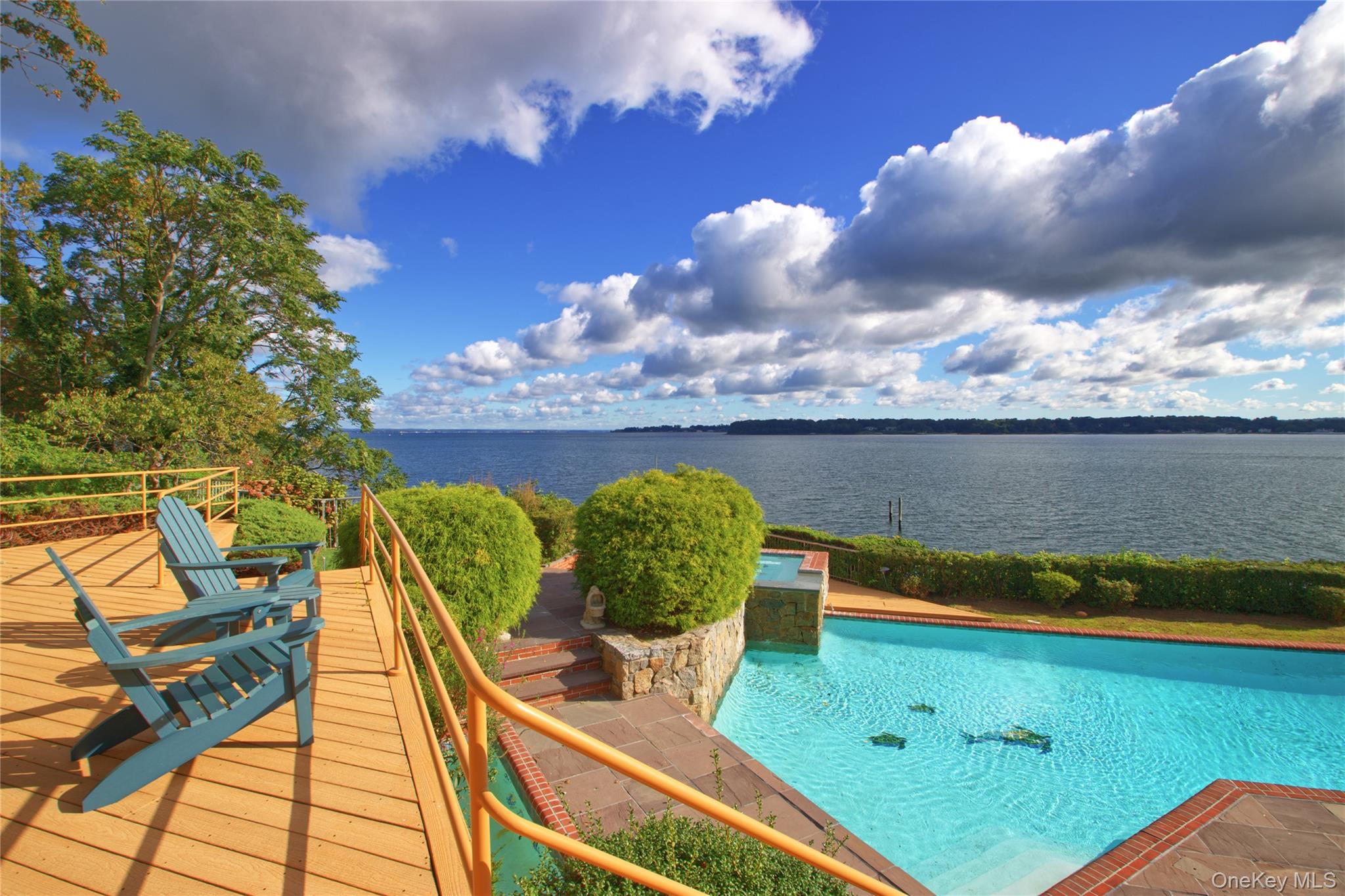 15 Gatsby Lane Great Neck, NY 11024 - Photo 11 of 12 a view of a swimming pool with lounge chair