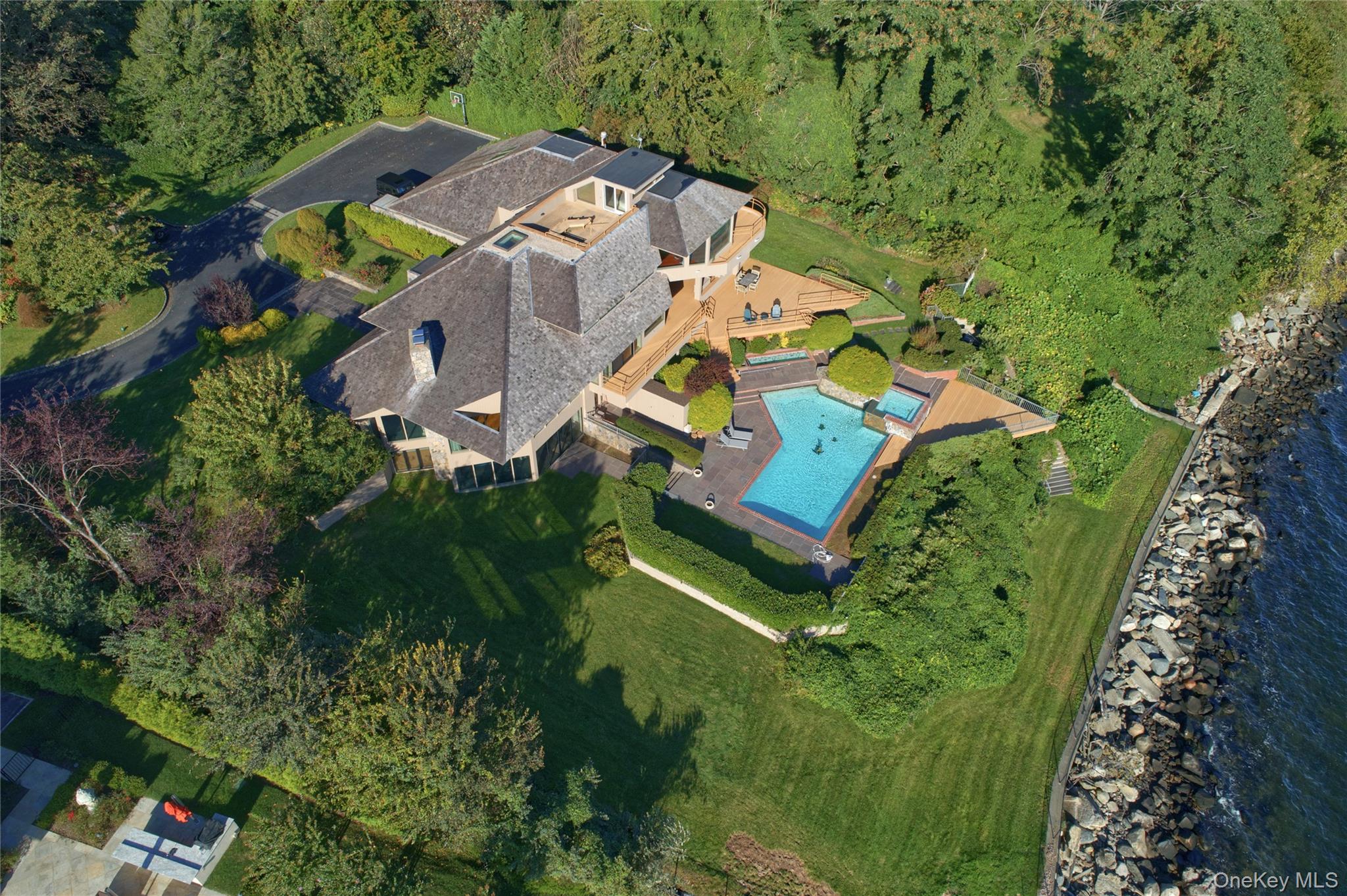 15 Gatsby Lane Great Neck, NY 11024 - Photo 2 of 12 an aerial view of residential house with outdoor space and swimming pool