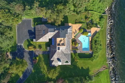 an aerial view of a house with a garden