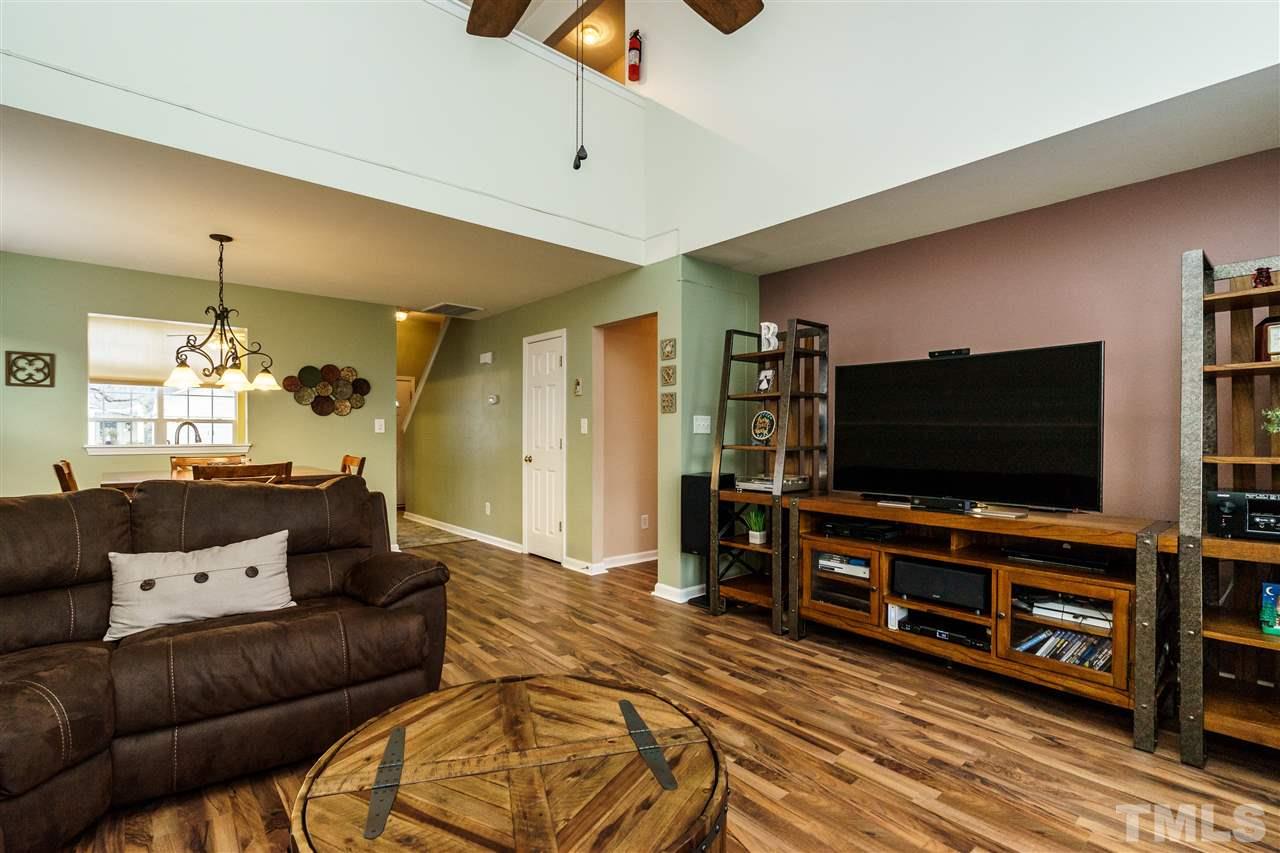 3809 Tyler Bluff Lane Raleigh, NC 27616 - Photo 14 of 25 a living room with furniture and a flat screen tv