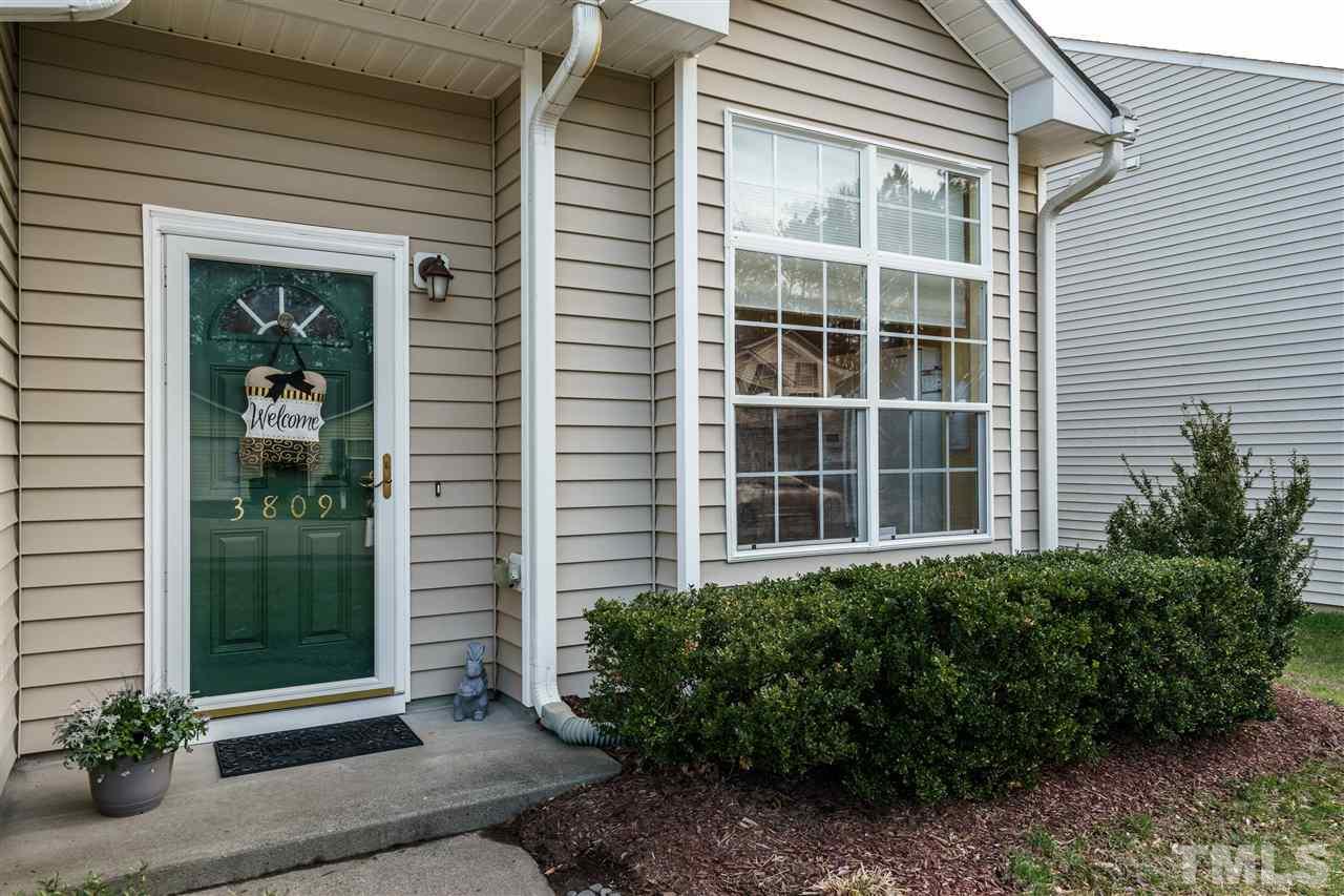 3809 Tyler Bluff Lane Raleigh, NC 27616 - Photo 3 of 25 a front view of a house with a yard