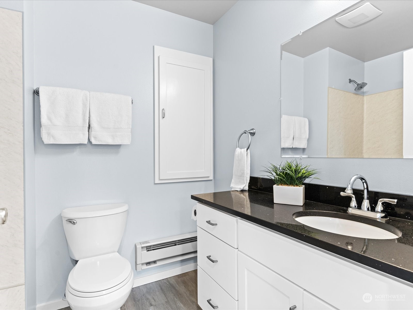5514 Lowell Road Everett, WA 98203 - Photo 15 of 26 a bathroom with a granite countertop toilet sink and mirror