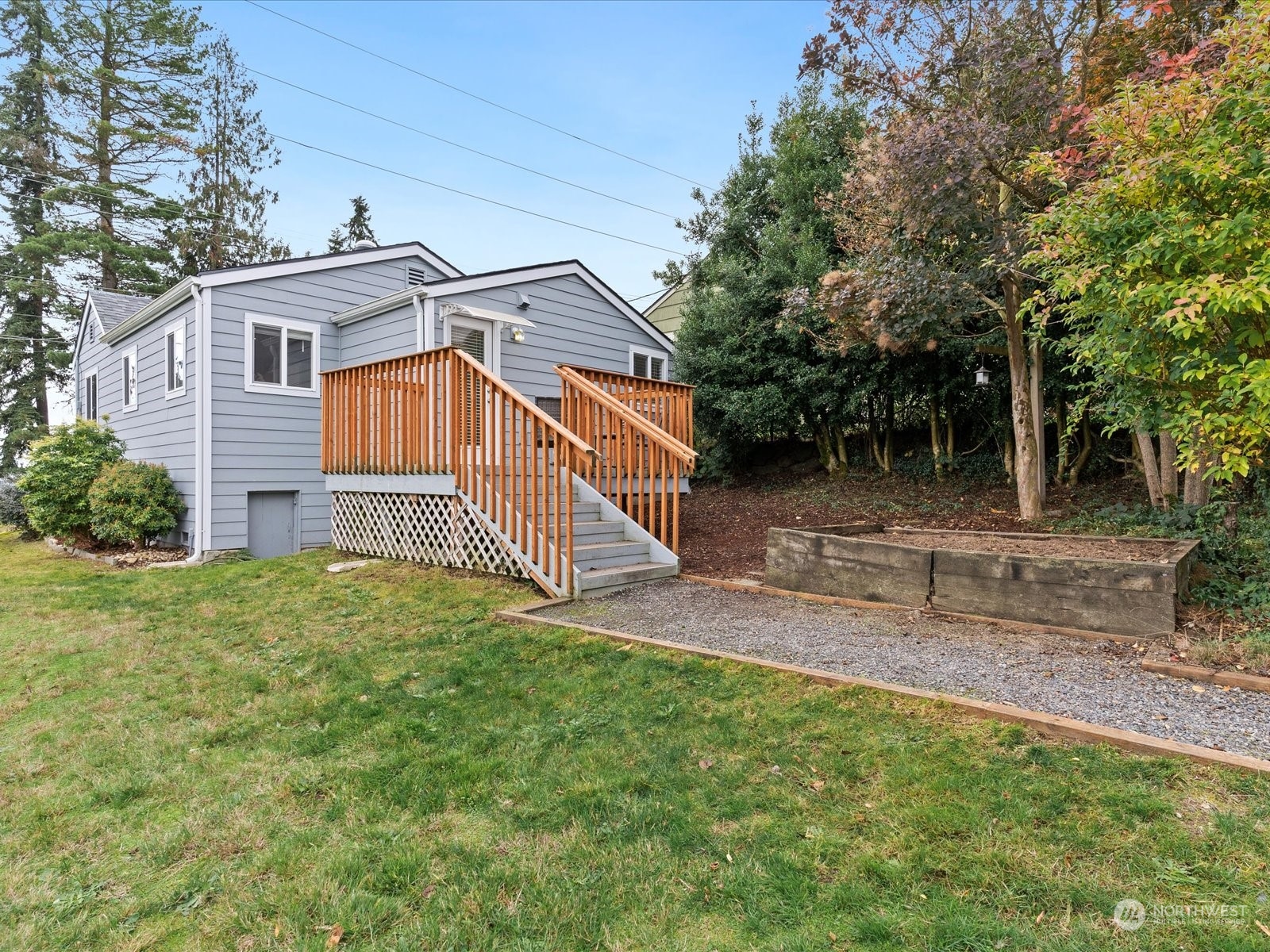 5514 Lowell Road Everett, WA 98203 - Photo 19 of 26 a view of a house with a yard and deck