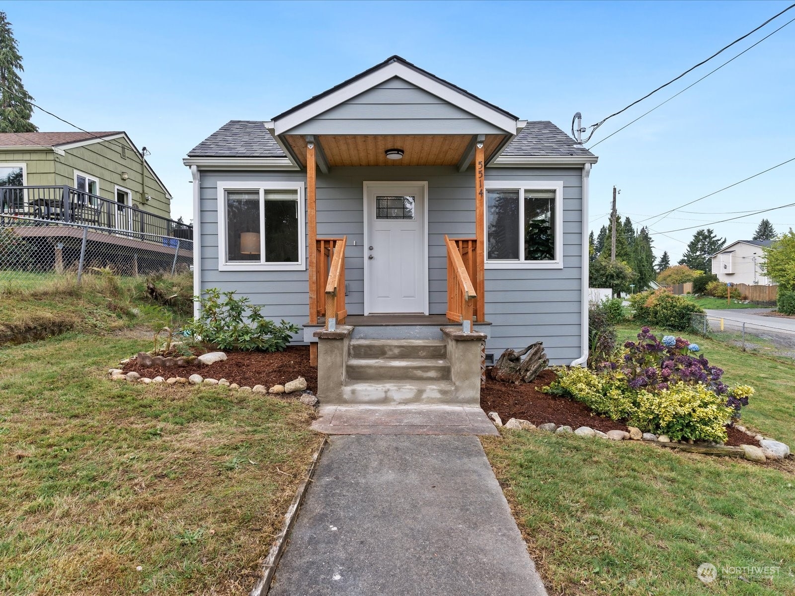 5514 Lowell Road Everett, WA 98203 - Photo 2 of 26 a front view of a house with garden