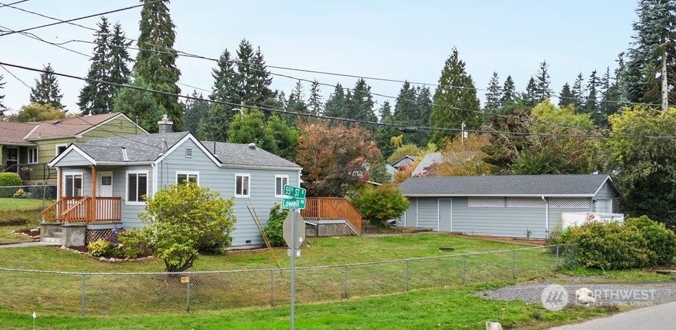 5514 Lowell Road Everett, WA 98203 - Photo 21 of 26 a front view of a house with garden