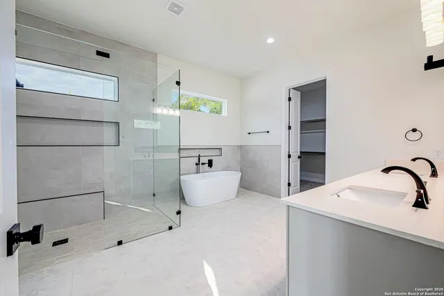 a bathroom with a sink and mirror