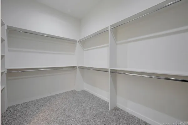 a view of an empty walk in closet