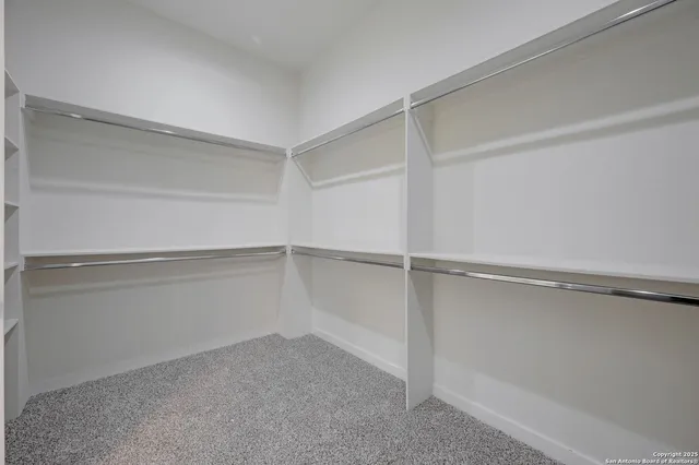 a view of an empty walk in closet