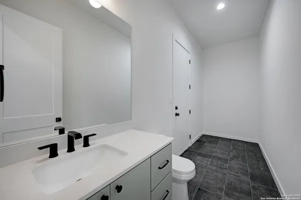 a bathroom with a sink and a toilet