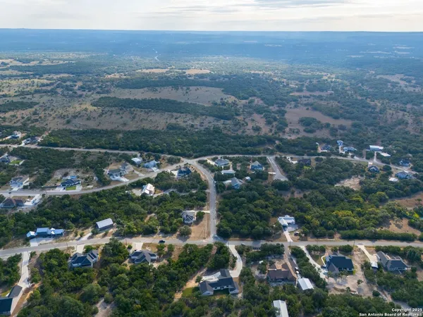an aerial view of house with yard