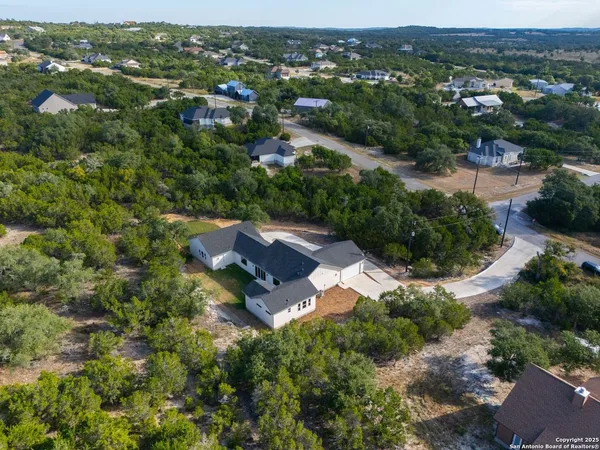 an aerial view of residential house with outdoor space