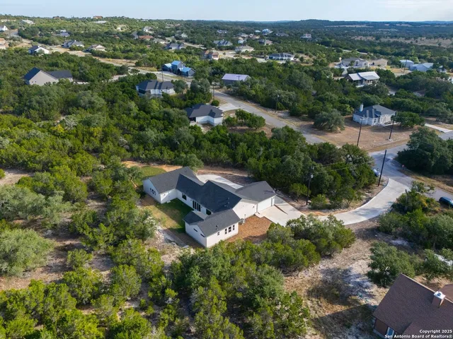 an aerial view of residential house with outdoor space