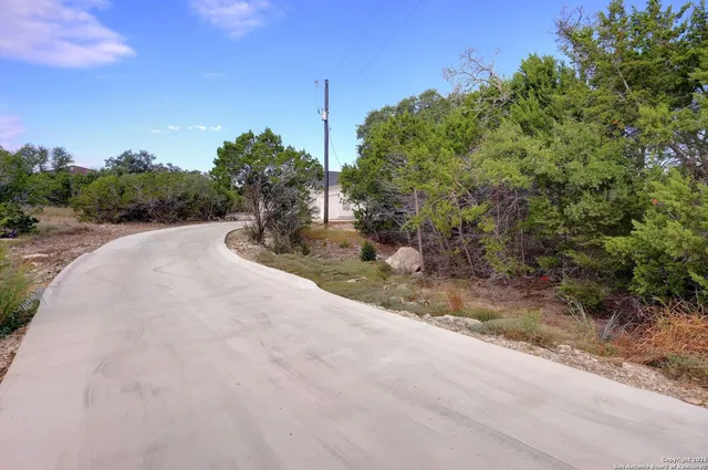 a view of a road with a building in the background