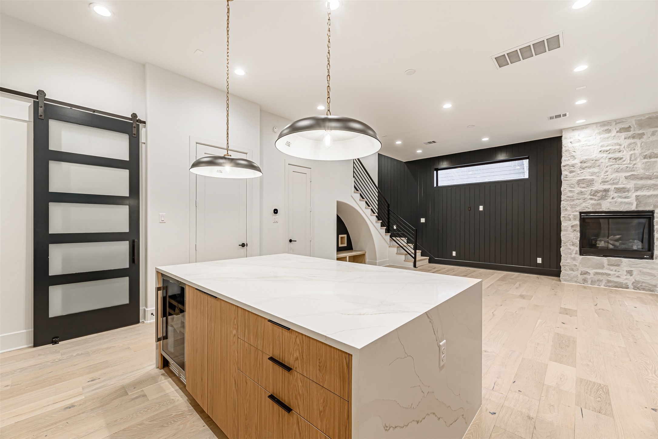 1104 West 9th Street Houston, TX 77007 - Photo 6 of 25 a kitchen with a stove a refrigerator and a fireplace