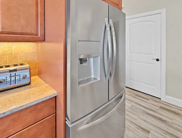 a view of a kitchen from the hallway