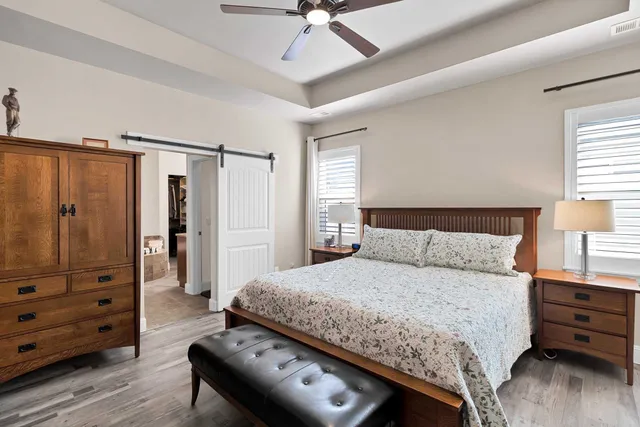 a bedroom with a bed and a dresser