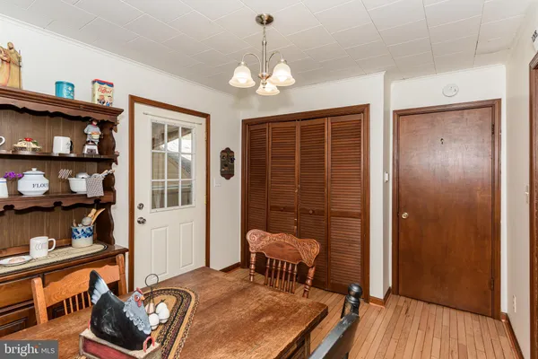 a view of a livingroom with furniture and staircase