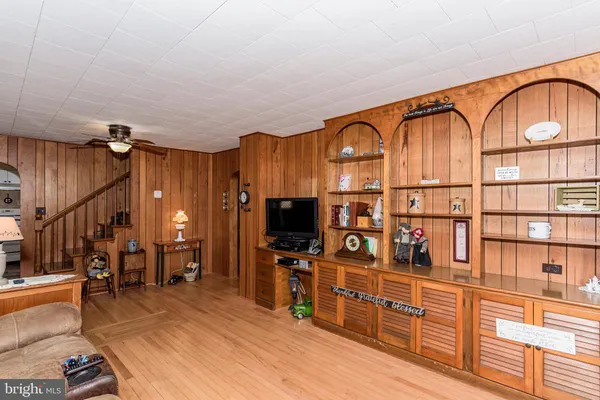 a view of a livingroom with furniture and a flat screen tv