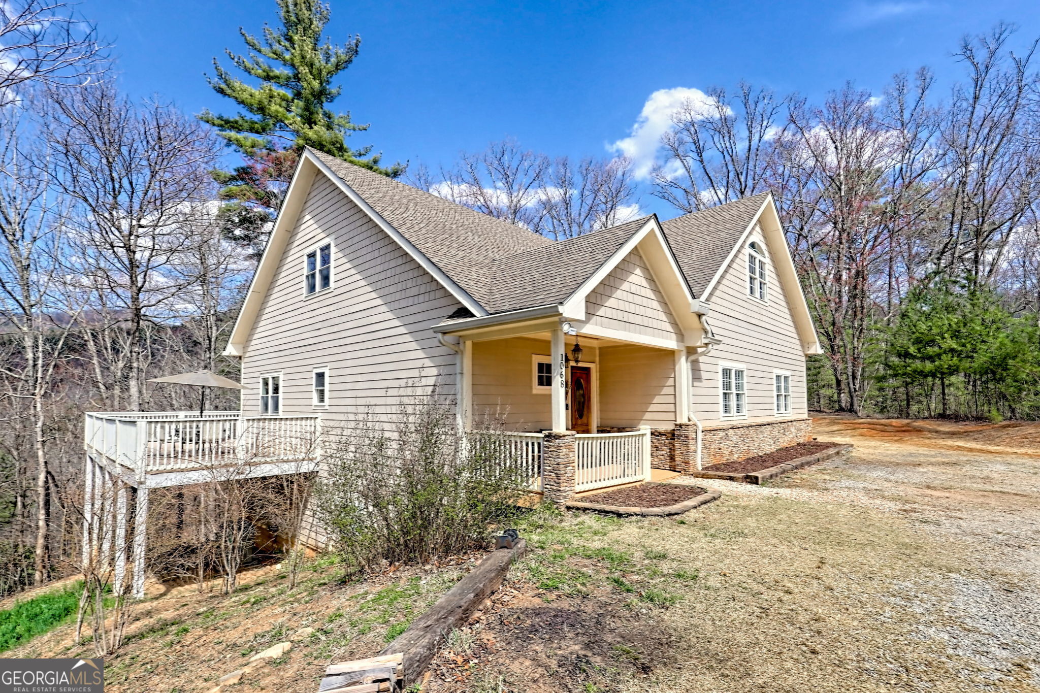 1068 Coleman River Road Clayton, GA 30525 - Photo 13 of 90 a backyard of a house with table and chairs